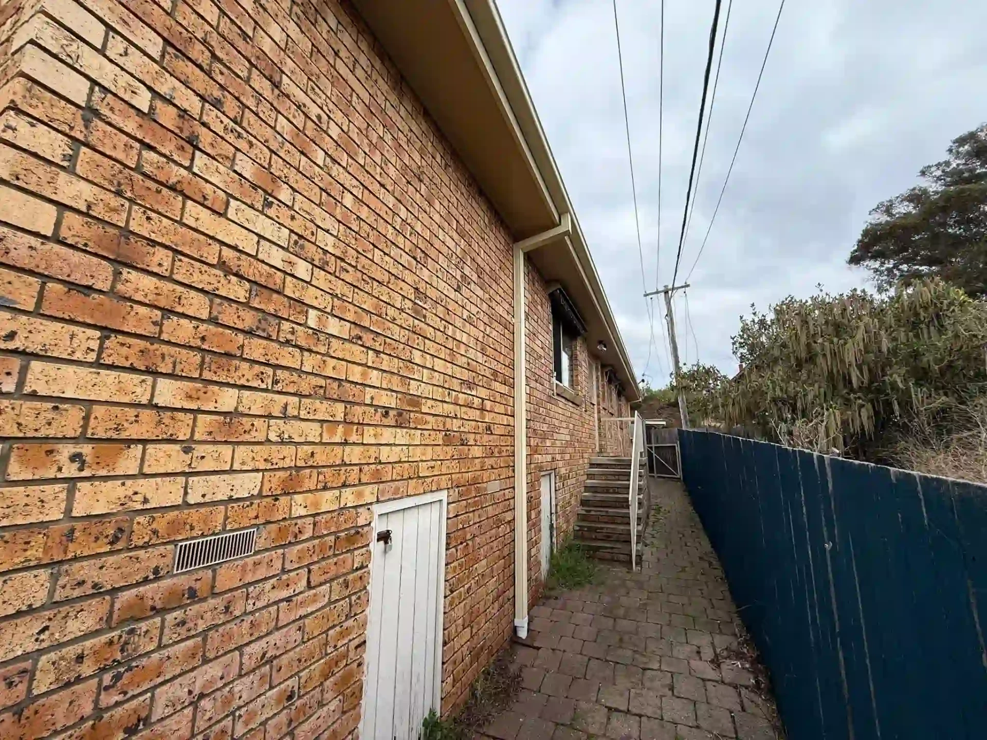 Close-up of new fascia covers and guttering running down the side of the Wanniassa home