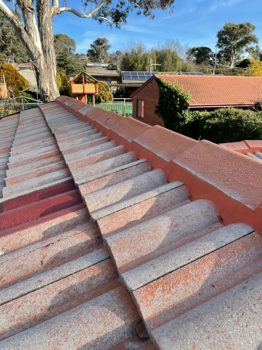 Tile roof valley and ridge after re-bedding and re-pointing