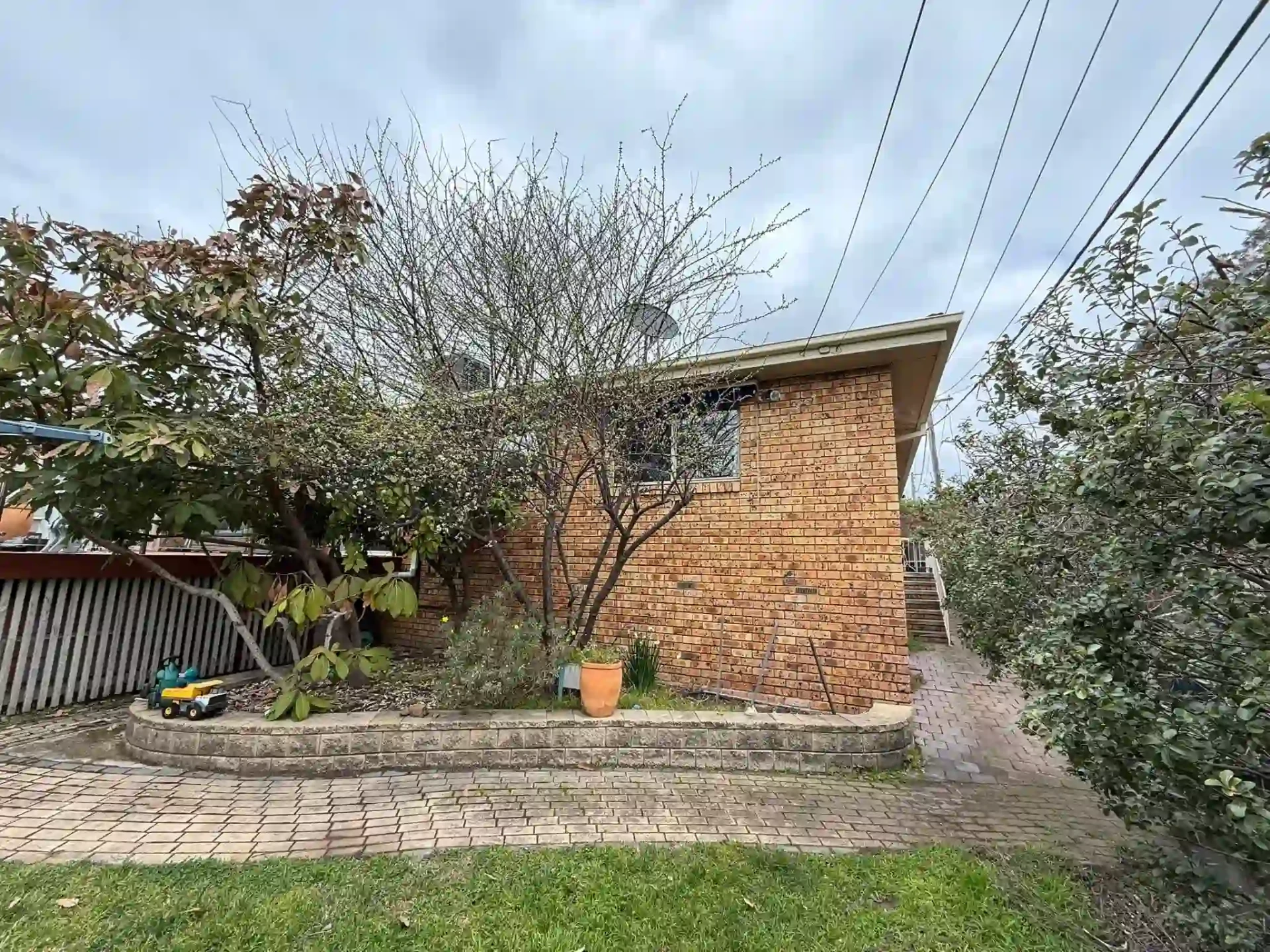 Rear garden view of the Wanniassa home with new fascia and roof trim