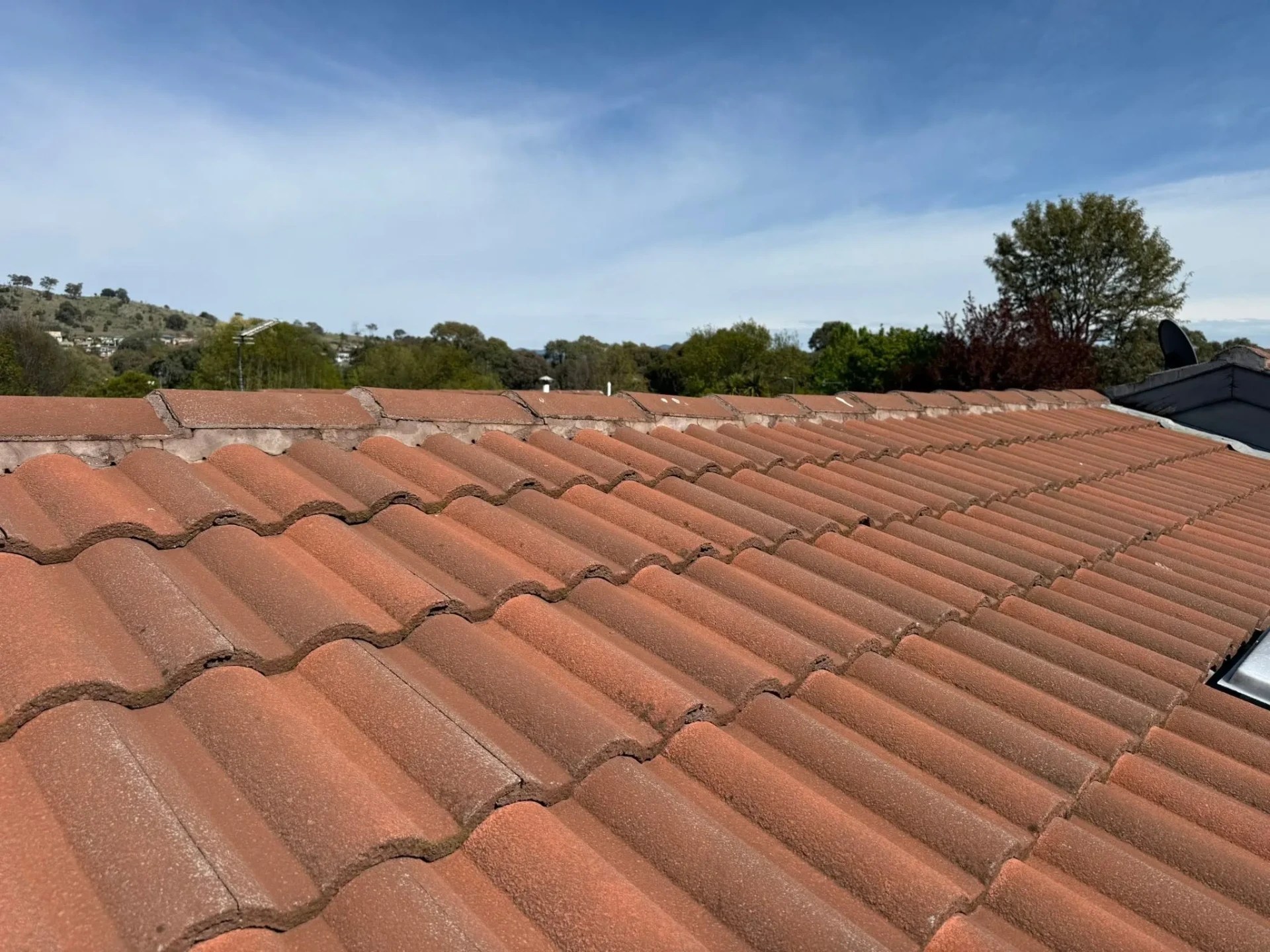 Close-up of re-bedded and re-pointed ridge capping on the Conder roof